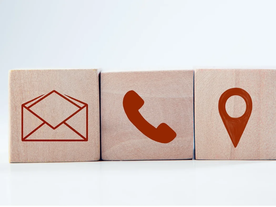 Contact symbols representing editorial email and website communication